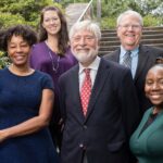 Group image, from top left to bottom right, Dr. Stephanie Wheeler, Dr. Bernard Weisman, Dr. Wendy Brewster, Dr. Sam Cycert, and Lauren Matthews. standing at the bottom of outdoor steps.