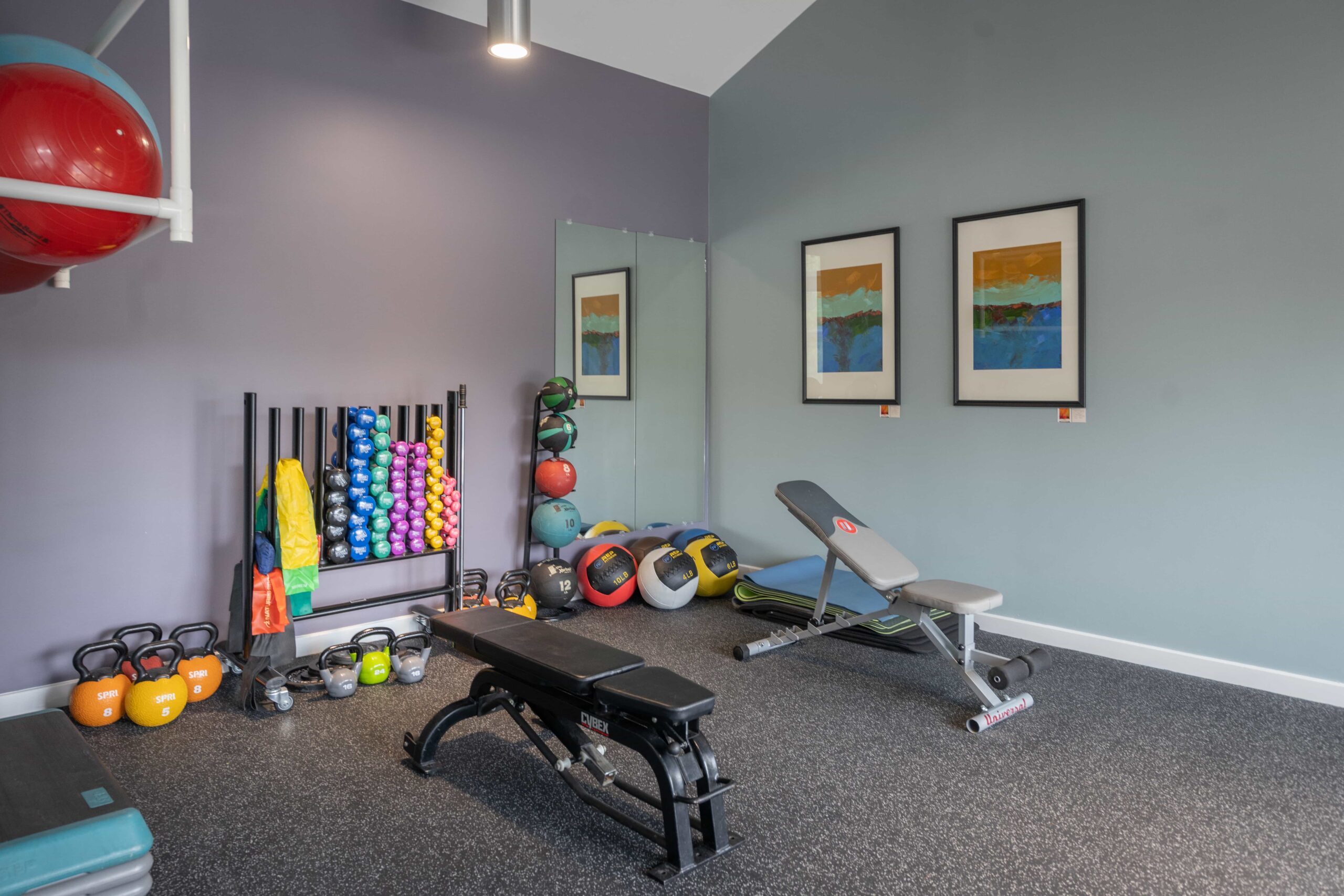 Exercise room with hand weights, benches and other exercise equipment