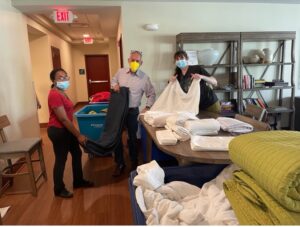 UNCLCN Team folding laundry at the SECU Family House.