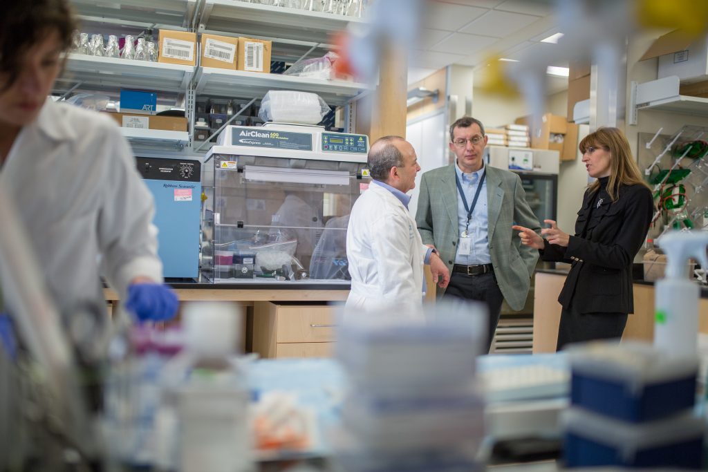 Gianpietro Dotti, MD, Barbara Savoldo, MD, PhD, and Jon Serody, MD discuss the opening of these groundbreaking trials in the immunotherapy lab space.