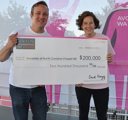 Marc Hurlbert, Avon Foundation Breast Cancer Crusade executive director presents a ceremonial check for $200,000 to Hazel Nichols, PhD