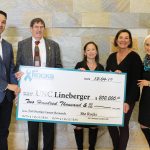 She ROCKS presents a $200,000 check to Members of members of UNC Lineberger.