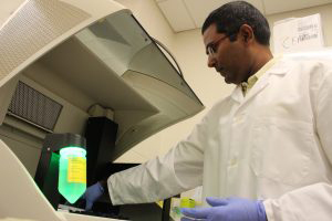 Sunil Kumar wearing a white coat in a lab