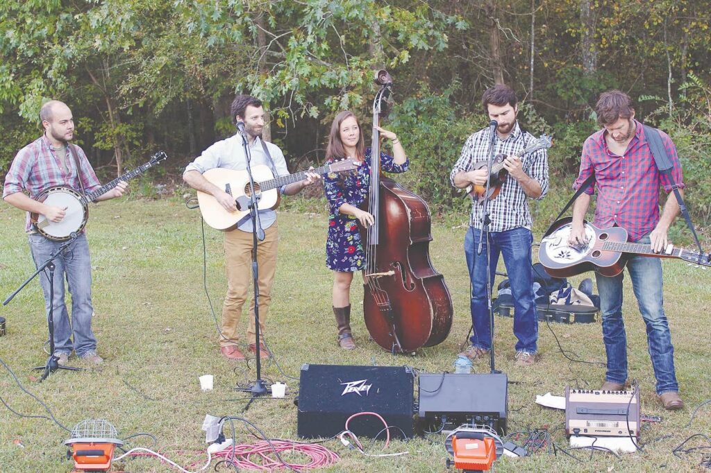 A bluegrass band plays music on the farm.