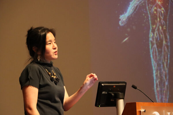Jen Jen Yeh presenting research at the Scientific Symposium