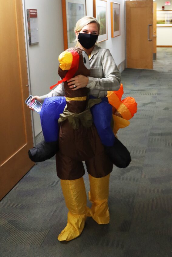 Oncology Patient Navigator Katie Kinsey bringing smiles dressed in a turkey costume.