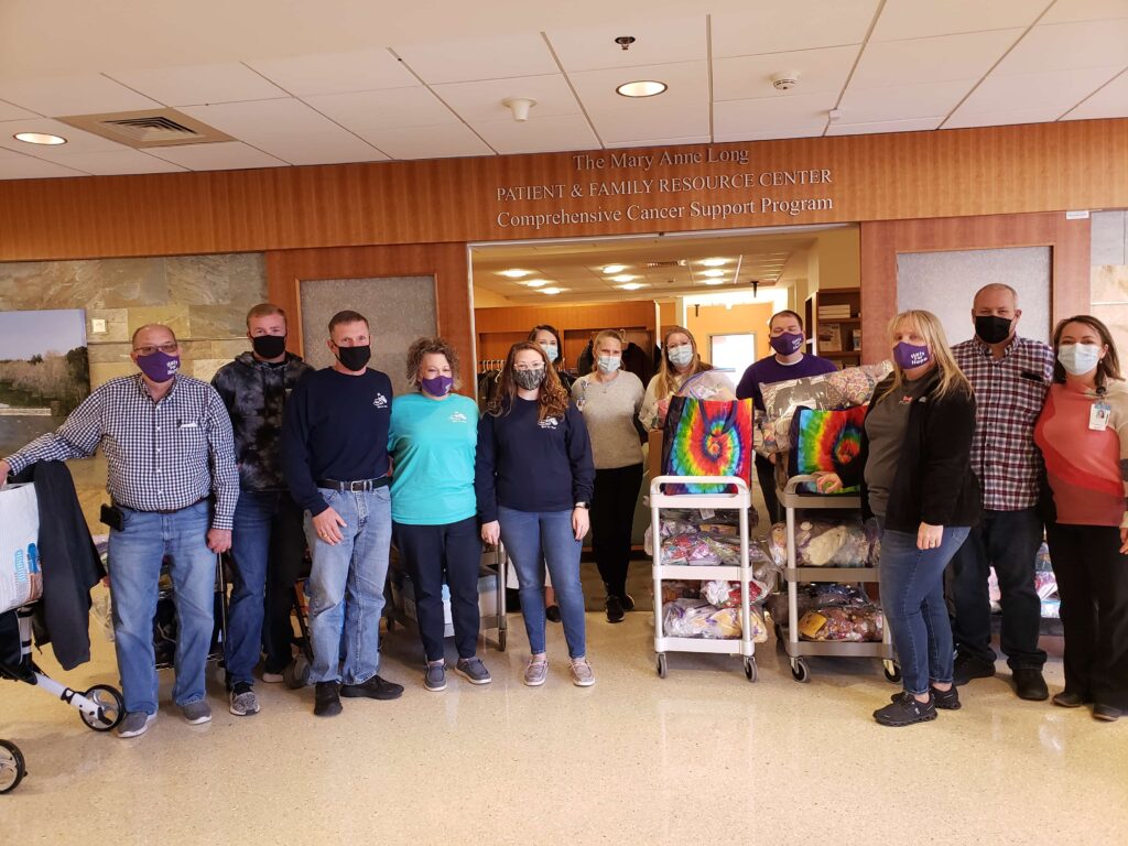 A group outside of the Patient and Family Resource Center with donations
