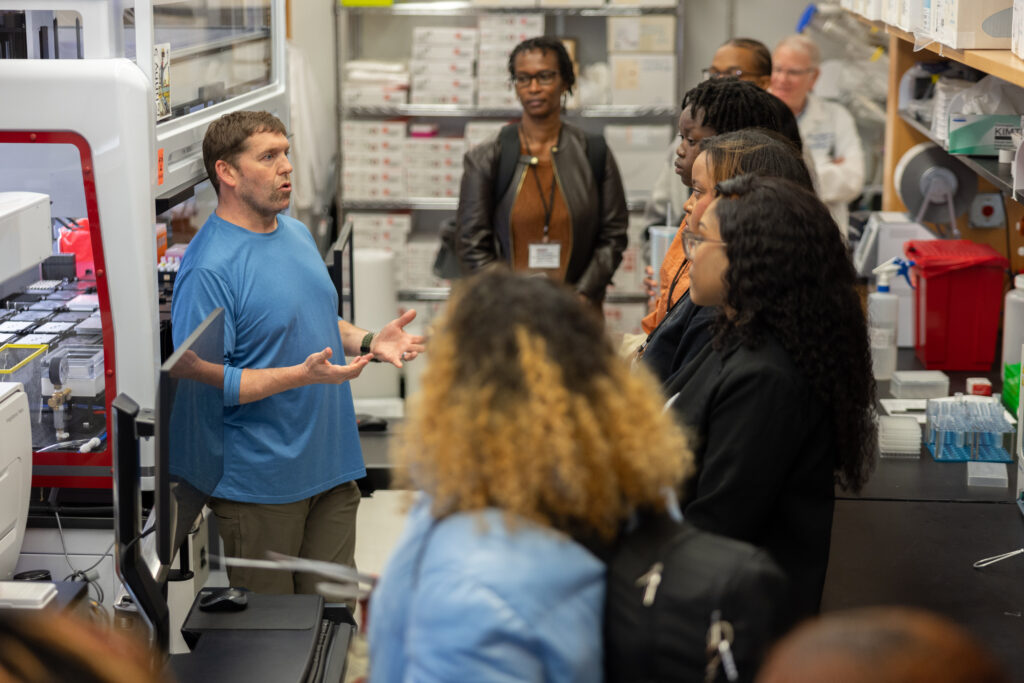 CRISPR Screening Facility Manager Brian Golitz talks to students about the genetic and epigenetic screening in the facility.