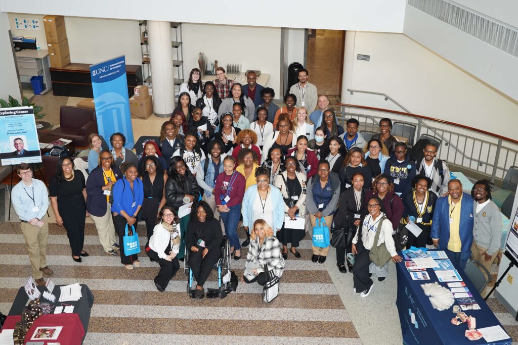 About 60 people from UNC Lineberger, NC A&T and NCCU in atrium lobby of the cancer center building.